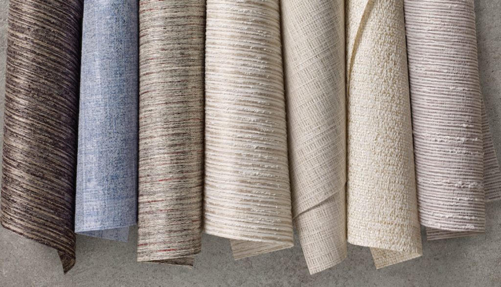 Fabric samples showing multiple colors and textures available for motorized window treatments