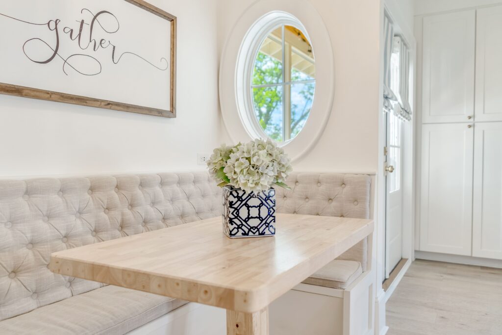 close-up of natural wood table and custom banquette seating