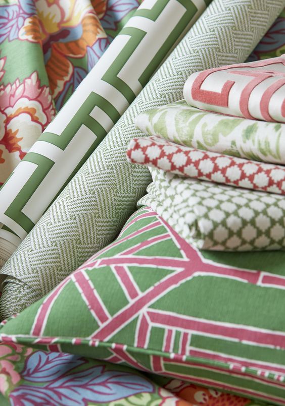 Fabric rolls on a pillow green and pink colors