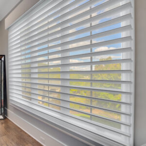 Motorized blinds covering a row of three windows