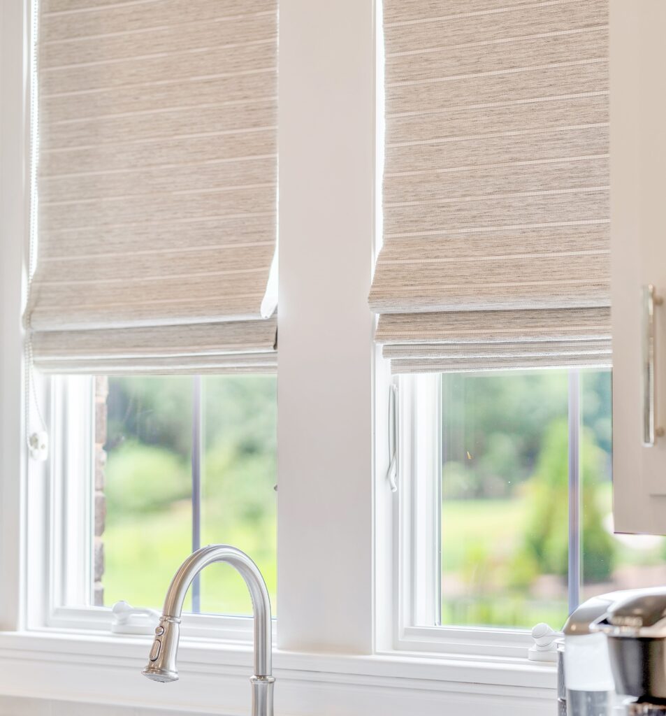 cream colored woven wood shades in white knoxville kitchen