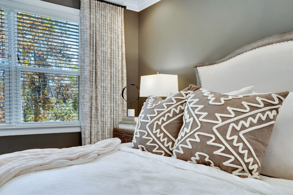 Tan, brown, and white bedroom with custom draperies in nashville