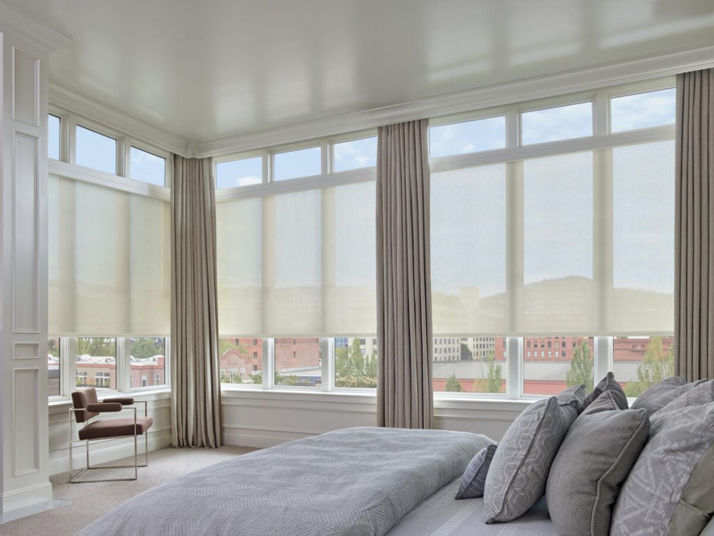 Roller shades over bedroom windows