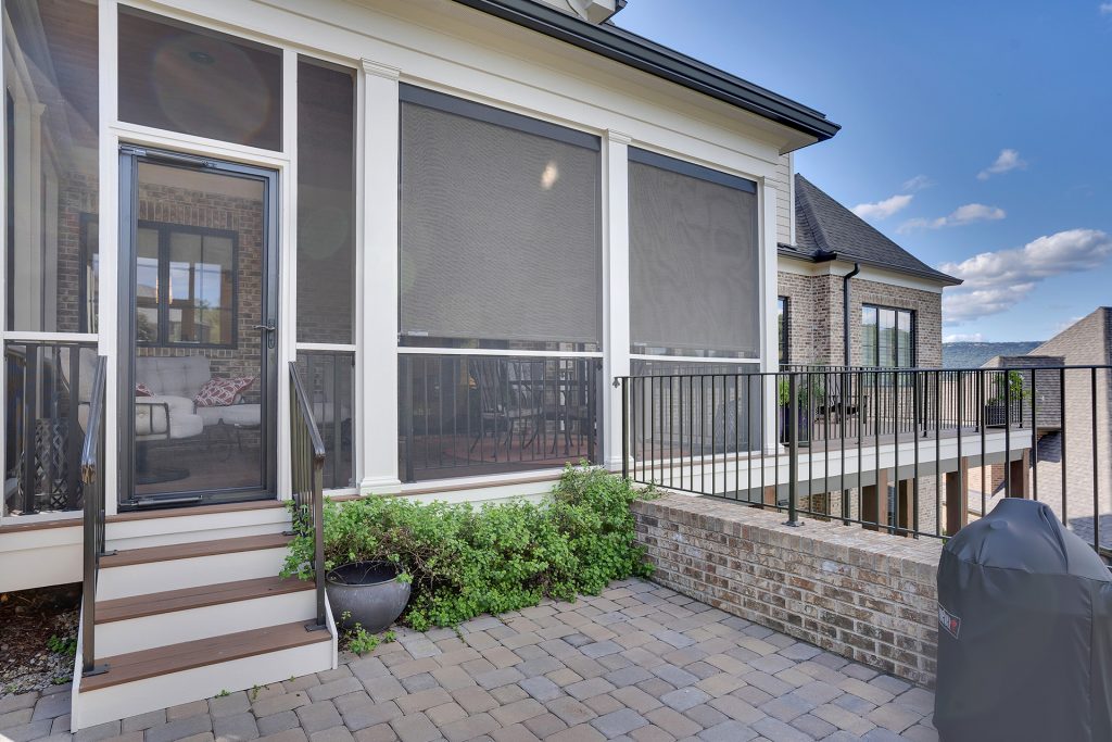 Entrance door having stairs and tiles on the front side of the house