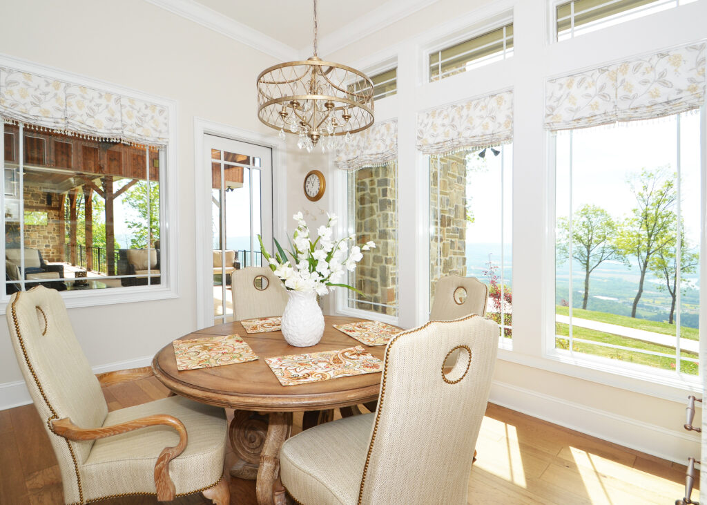 neutral dining area in jasper highlands kitchen with gorgeous roman shades